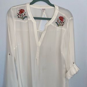 sheer white blouse with flower detailing